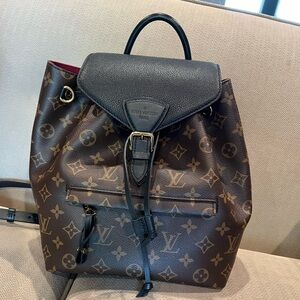 Louis Vuitton backpack. Black and monogram.  2023 backpack with charm,